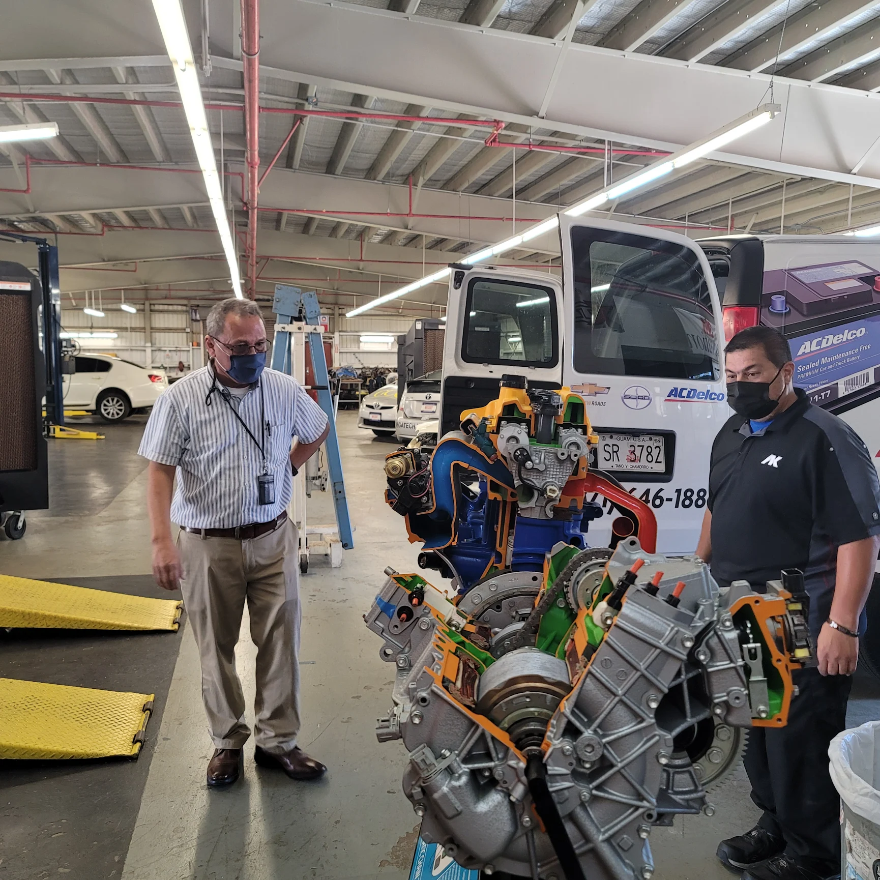 j._pete_roberto_gcc_assoc._dean_with_ak_prepare_to_load_hybrid_engine_for_transportation_to_ak.webp